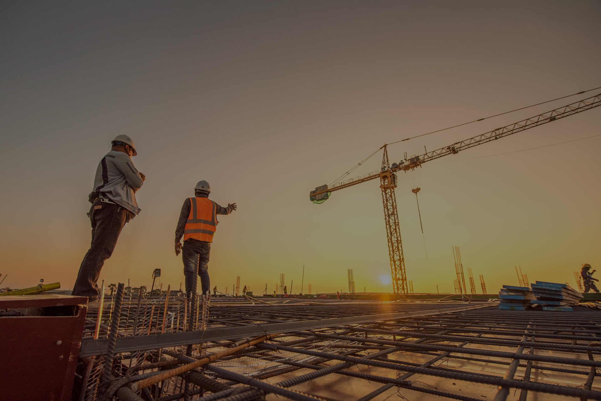 Large construction site with a tower crane and structural works