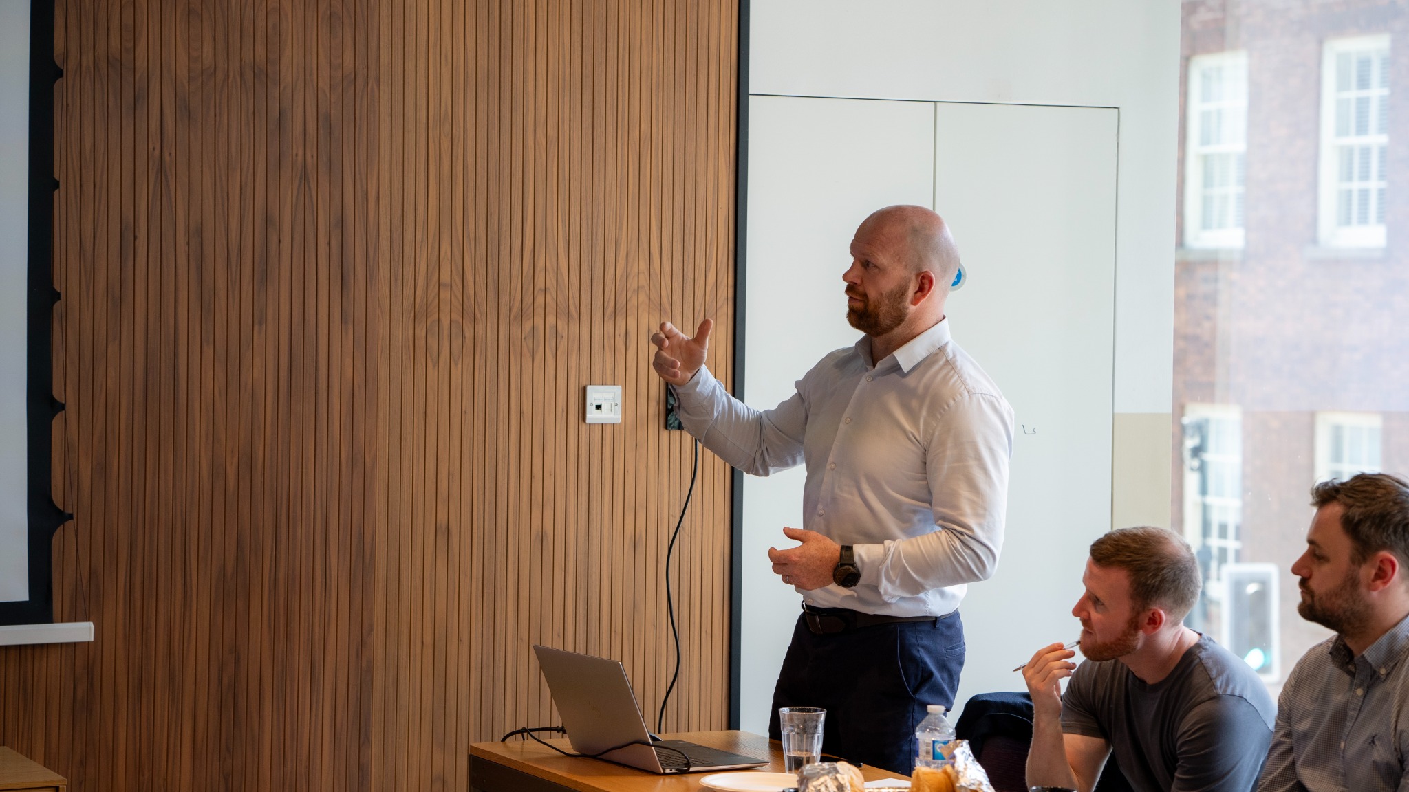 A consultant delivering a training session to colleagues